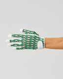 A single hand wearing a green and white patterned protective glove, shown against a plain light gray studio background.