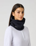 Daily Sports Hudson Navy Neck Warmer in navy blue – women's ribbed knit golf neck warmer snood styled over white zip-neck base layer, side view