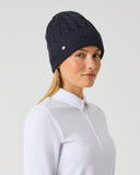 Daily Sports Navy Cable Knit Hat in navy – women's chunky cable-knit golf beanie with ribbed cuff and silver logo pin, side view