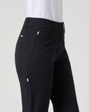 Black high-waisted golf pants with zippered pockets, shown on a model from a side profile view against a light gray background.
