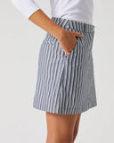 Daily Sports Stripe Dark Navy Skort close-up of dark navy and white vertical pinstripe fabric with tailored elasticated waistband and angled side pocket detail, side view