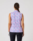 Woman wearing a sleeveless patterned top on a plain background