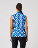 Person wearing a blue patterned sleeveless top on a white background