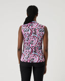 Person wearing a sleeveless pink and black patterned top on a white background