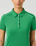 Daily Sports Leaf Piping Short Sleeve Polo close-up of green fabric with white contrast shoulder and side piping trim, classic polo collar and white pearl button placket detail