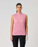 A woman modeling a sleeveless collared button-front top with a red and white gingham pattern, paired with black pants and a white glove, against a light gray studio background.