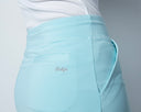 Light blue pants with a brand logo on a gray background