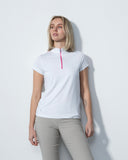 Woman wearing a white t-shirt with a red zipper against a light gray background