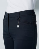 Black pants with a silver zipper on a white background