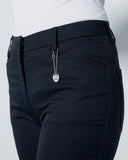 Black pants with a silver zipper on a light gray background