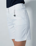 White shorts worn by a person on a plain background