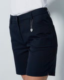 Black shorts worn by a person on a plain background