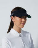 Woman wearing a black visor and white shirt against a light gray background