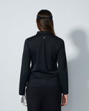 Person wearing a black outfit with a blurred face on a white background