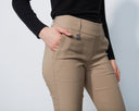 Beige pants worn by a person on a white background