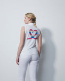 Person wearing a white outfit with a colorful heart design on the back against a light gray background