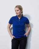 Woman wearing a blue polo shirt against a white background