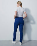 Person wearing a white shirt and blue pants against a plain white background