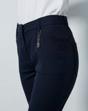 Dark navy capris pants with a white shirt on a light gray background