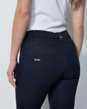 Person wearing navy pants with a visible brand logo on a white background
